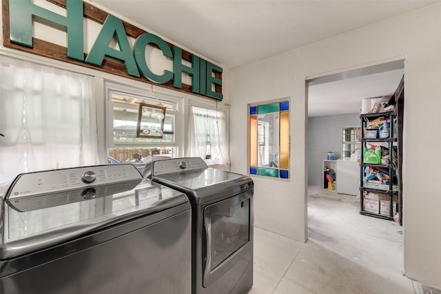 laundry area with separate washer and dryer and laundry area