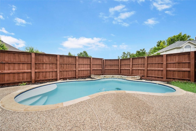 view of swimming pool featuring a fenced backyard, a fenced in pool, and a patio area