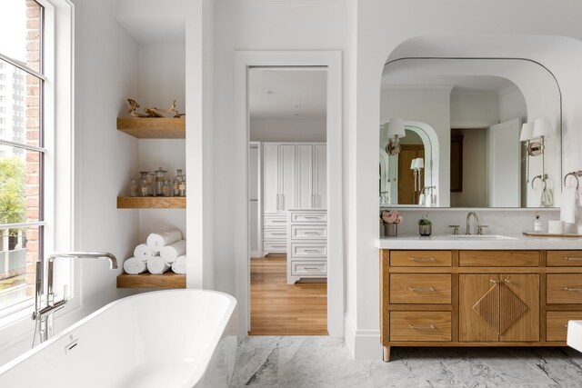 3201 Beverly, Highland Park, TX 75205 - full bath featuring a freestanding bath, marble finish flooring, and vanity