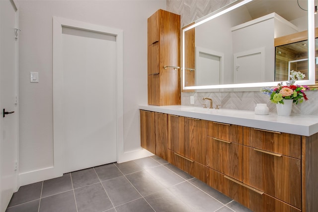 bathroom featuring vanity, decorative backsplash, and tile patterned flooring