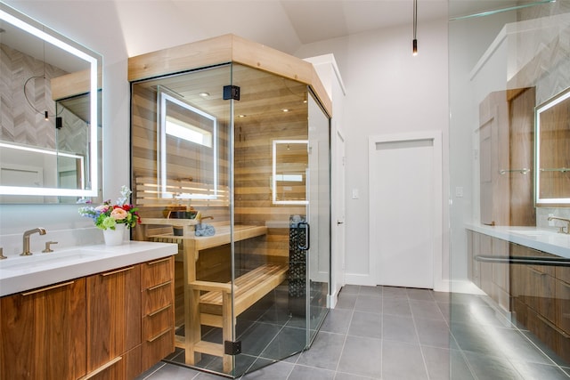 full bathroom featuring tile patterned floors, two vanities, a sink, and a sauna