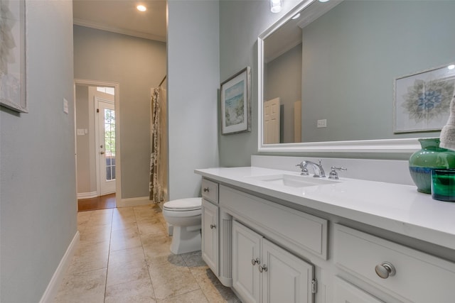 bathroom featuring vanity, baseboards, toilet, ornamental molding, and a shower with shower curtain