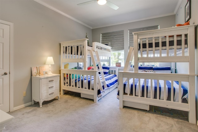 bedroom with carpet flooring, a ceiling fan, crown molding, and baseboards