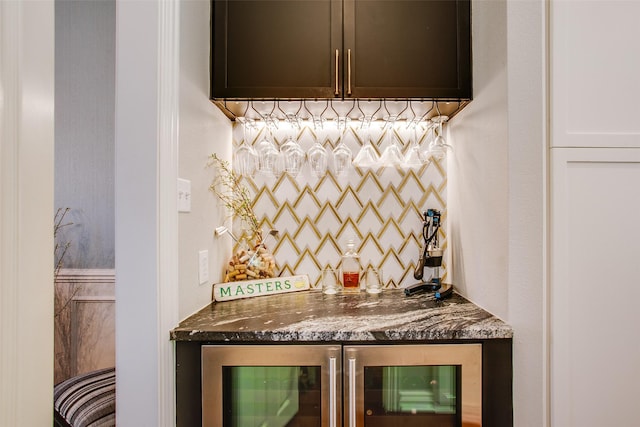bar with wine cooler and a bar