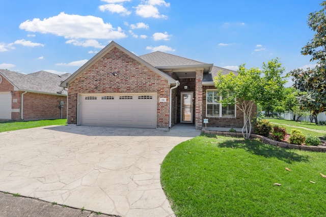 ranch-style house featuring a garage, brick siding, a front lawn, and driveway