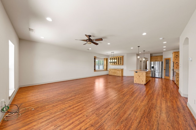 unfurnished living room featuring visible vents, recessed lighting, wood finished floors, and a ceiling fan