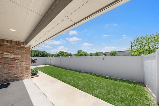 view of yard with a patio and a fenced backyard