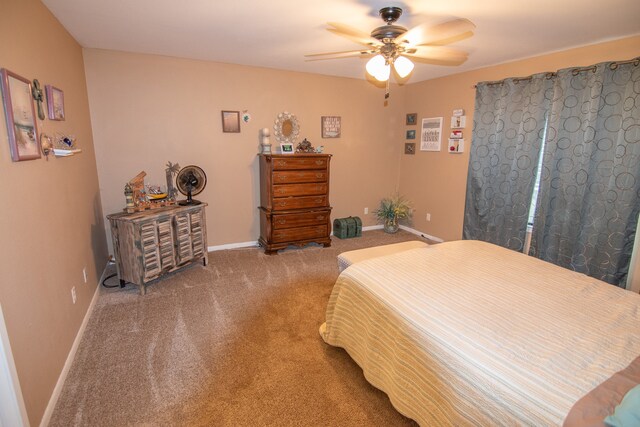 bedroom with baseboards, a ceiling fan, and carpet floors