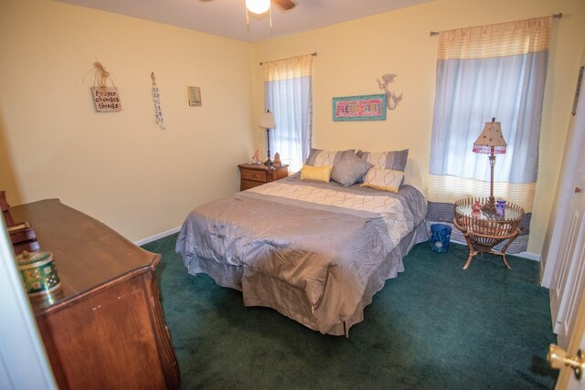 carpeted bedroom featuring baseboards