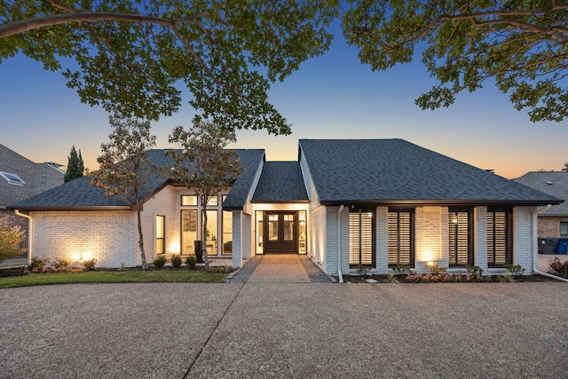 5702 Glen Heather Dr, Dallas, TX 75252 - view of front of house with french doors, roof with shingles, and brick siding