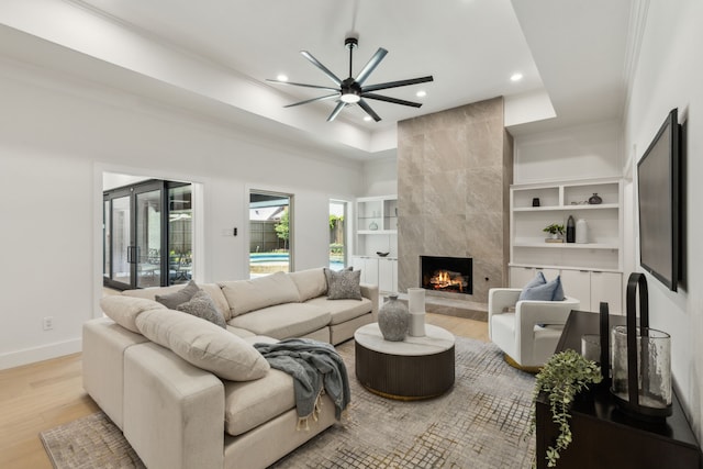 5702 Glen Heather Dr, Dallas, TX 75252 - living area featuring ceiling fan, recessed lighting, a high end fireplace, light wood-type flooring, and ornamental molding