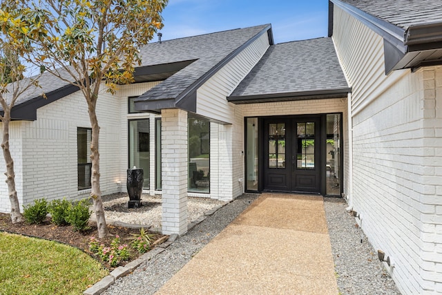 5702 Glen Heather Dr, Dallas, TX 75252 - entrance to property with brick siding, roof with shingles, and french doors