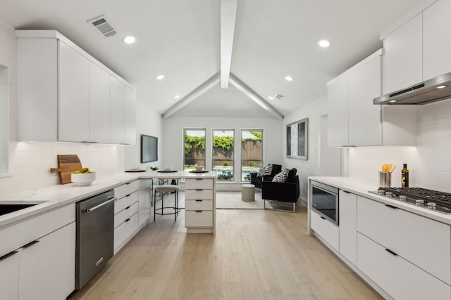 5702 Glen Heather Dr, Dallas, TX 75252 - kitchen with stainless steel appliances, light wood-style floors, white cabinetry, tasteful backsplash, and open floor plan