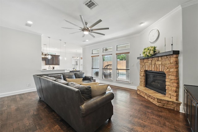 5314 Meritage Ln, Grapevine, TX 76051 - living area with a ceiling fan, a stone fireplace, crown molding, dark wood-type flooring, and baseboards