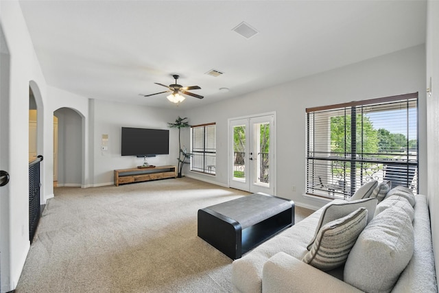 5314 Meritage Ln, Grapevine, TX 76051 - living area with french doors, arched walkways, carpet floors, a ceiling fan, and baseboards