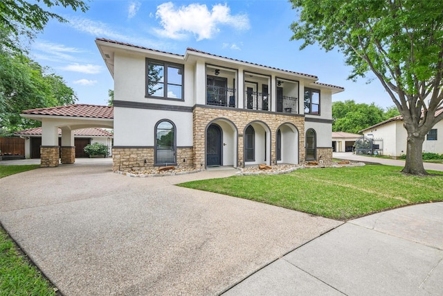 5314 Meritage Ln, Grapevine, TX 76051 - mediterranean / spanish-style house with a balcony, stone siding, driveway, and stucco siding