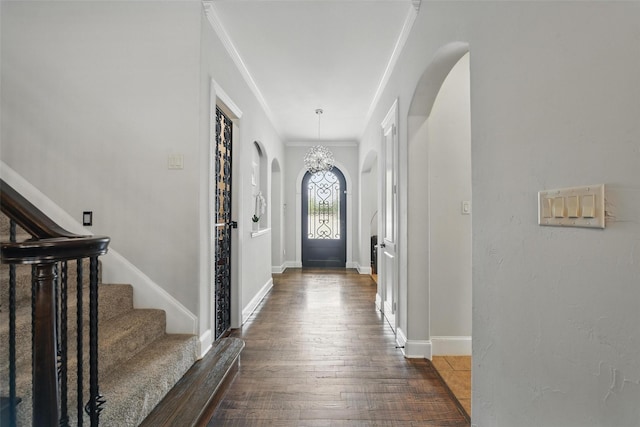 5314 Meritage Ln, Grapevine, TX 76051 - foyer featuring arched walkways, wood finished floors, baseboards, crown molding, and stairway