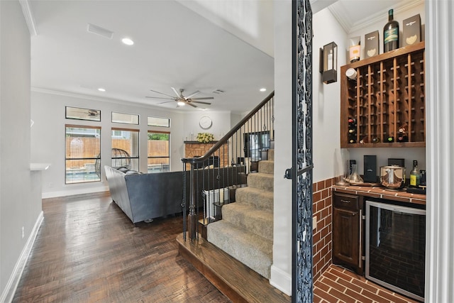 5314 Meritage Ln, Grapevine, TX 76051 - wine area featuring wine cooler, a bar, crown molding, ceiling fan, and recessed lighting