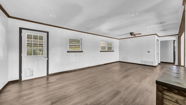 760 College Farm, Stephenville, TX 76401 - interior space featuring ceiling fan, visible vents, baseboards, ornamental molding, and wood finished floors