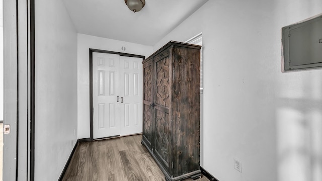 760 College Farm, Stephenville, TX 76401 - corridor with electric panel, wood finished floors, and baseboards