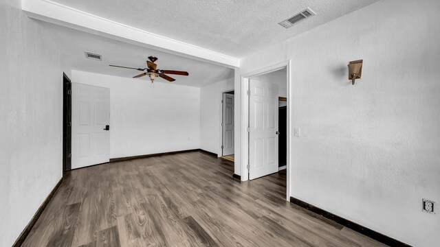 760 College Farm, Stephenville, TX 76401 - unfurnished room with baseboards, visible vents, wood finished floors, and a ceiling fan
