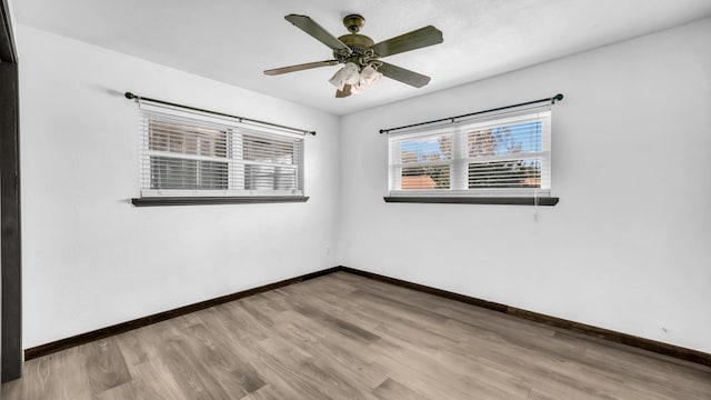 760 College Farm, Stephenville, TX 76401 - spare room with baseboards, wood finished floors, and a ceiling fan