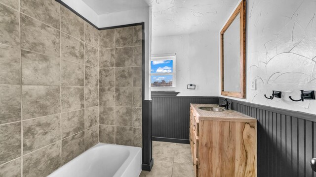 760 College Farm, Stephenville, TX 76401 - full bathroom featuring tile patterned floors, wainscoting, bathtub / shower combination, and vanity