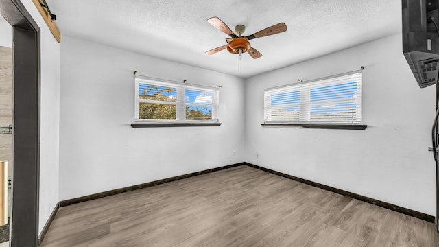 760 College Farm, Stephenville, TX 76401 - spare room featuring baseboards, wood finished floors, a ceiling fan, and a textured ceiling