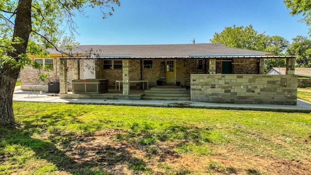 760 College Farm, Stephenville, TX 76401 - ranch-style home with a jacuzzi, a front yard, a patio, and brick siding
