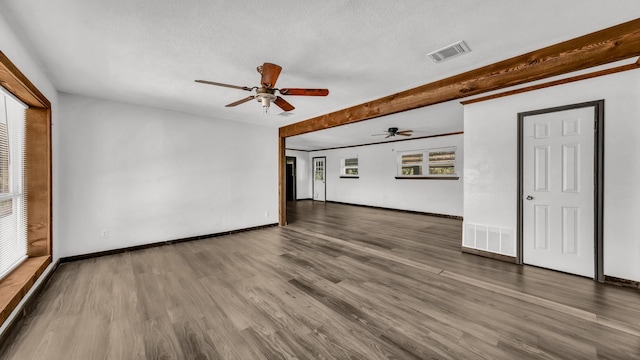 760 College Farm, Stephenville, TX 76401 - unfurnished living room with visible vents, ceiling fan, wood finished floors, and baseboards