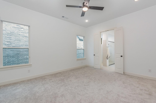 empty room featuring ceiling fan, visible vents, baseboards, carpet, and recessed lighting