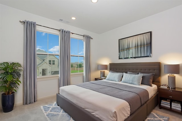 carpeted bedroom with baseboards, recessed lighting, and visible vents