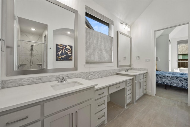 ensuite bathroom with a stall shower, ensuite bathroom, vanity, and plenty of natural light