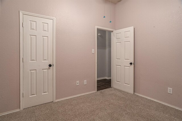 unfurnished bedroom featuring carpet