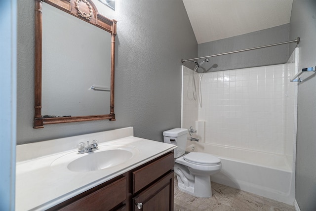 full bath with vaulted ceiling, shower / bathing tub combination, toilet, a textured wall, and vanity