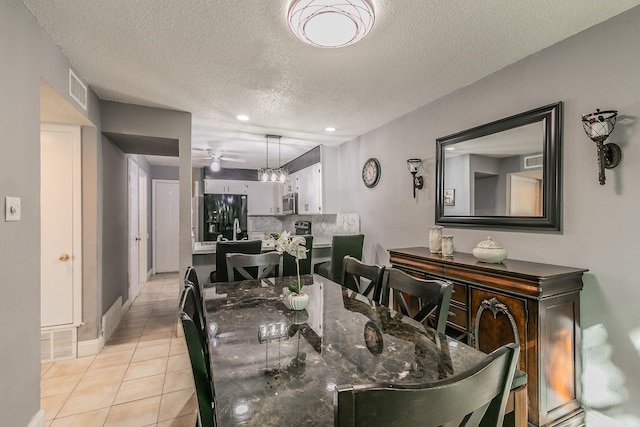 dining area featuring recessed lighting, visible vents, a ceiling fan, a textured ceiling, and light tile patterned flooring