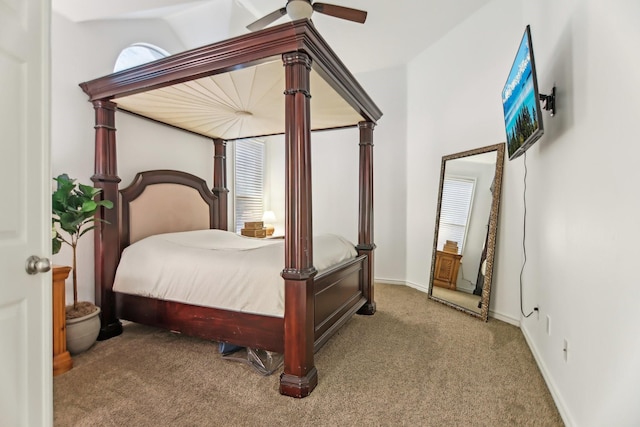 carpeted bedroom with baseboards and ceiling fan