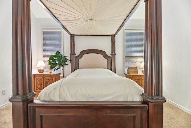 bedroom featuring carpet flooring and baseboards