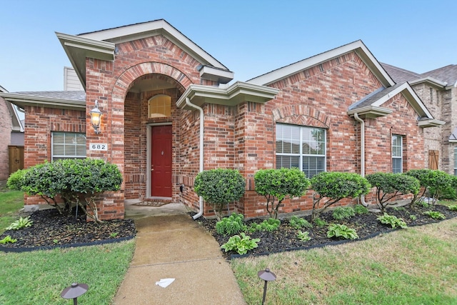 traditional-style house with brick siding