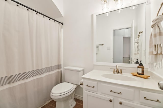 full bathroom featuring vanity, tile patterned floors, toilet, and a shower with shower curtain