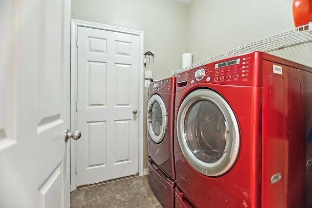 laundry area with laundry area, tile patterned floors, and washer and dryer