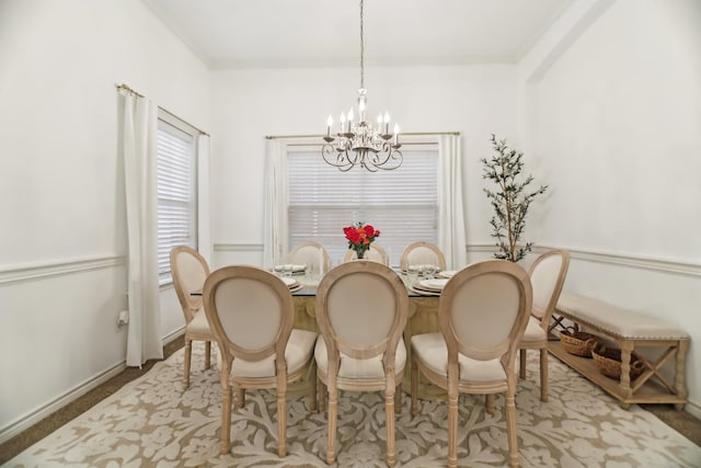 dining space featuring a chandelier