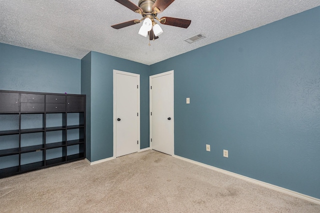 1520 Belgrade Dr, Plano, TX 75023 - unfurnished bedroom with carpet flooring, a textured ceiling, and ceiling fan
