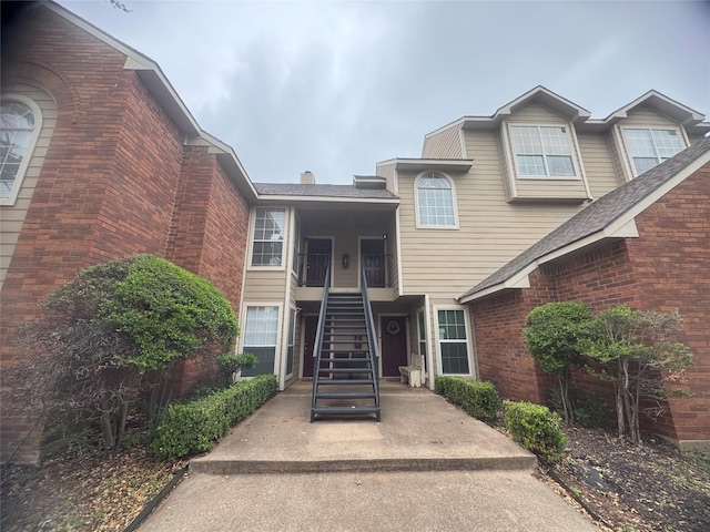 view of property featuring stairs