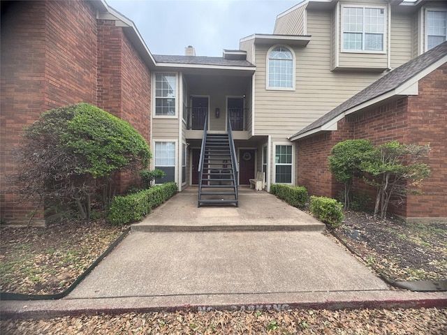 entrance to property with brick siding