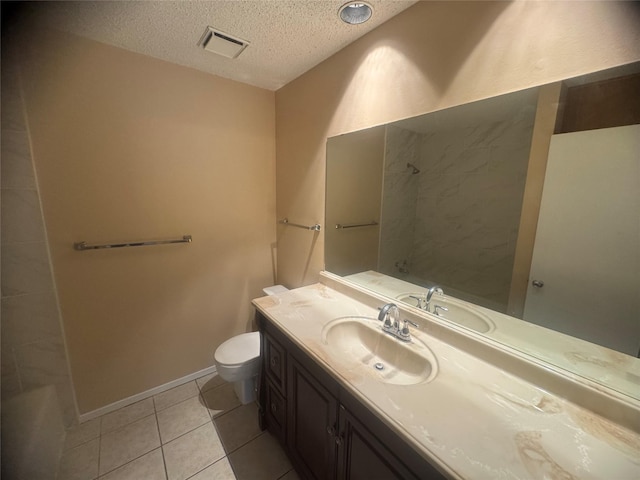 bathroom with a textured ceiling, a shower, visible vents, toilet, and tile patterned floors