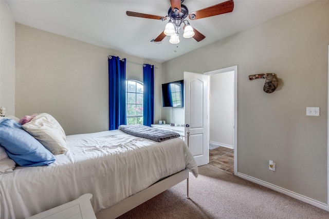 bedroom featuring baseboards, ceiling fan, and carpet floors