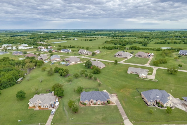birds eye view of property with a residential view
