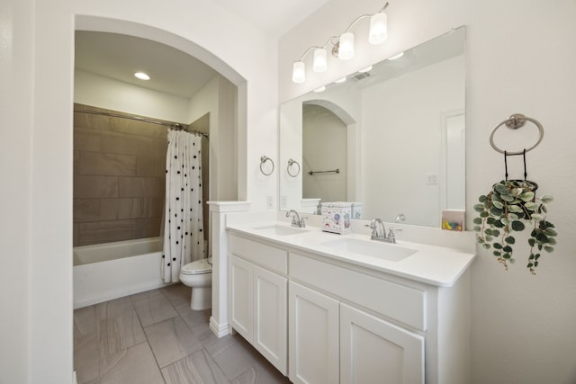 2321 Molly Ln, Plano, TX 75074 - full bathroom with visible vents, toilet, double vanity, and a sink
