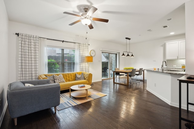 2321 Molly Ln, Plano, TX 75074 - living room featuring dark wood finished floors, recessed lighting, ceiling fan, baseboards, and visible vents
